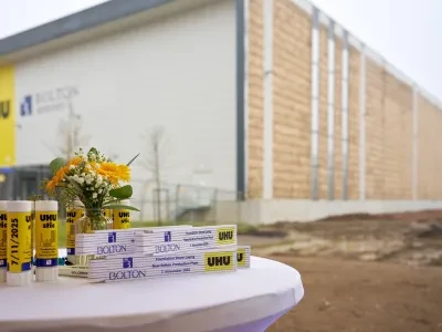 Bolton's UHU products are displayed on a table, the current UHU centre is right behind them